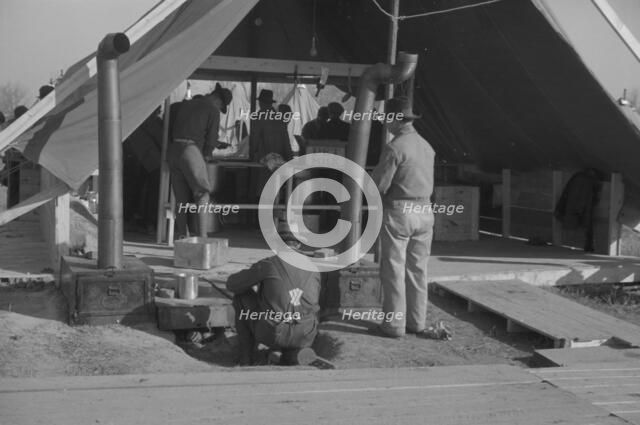 The kitchen in the camp for white flood refugees at Forrest City, Arkansas, 1937. Creator: Walker Evans.