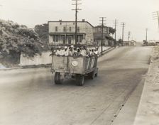 The last truckload of cotton hoers from Memphis bound for the Wilson Cotton..., June 1937. Creators: Farm Security Administration, Dorothea Lange
