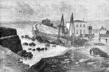 The Late Storms: breach in the sea wall on the strand at Youghal, Ireland, 1881. Creator: Unknown