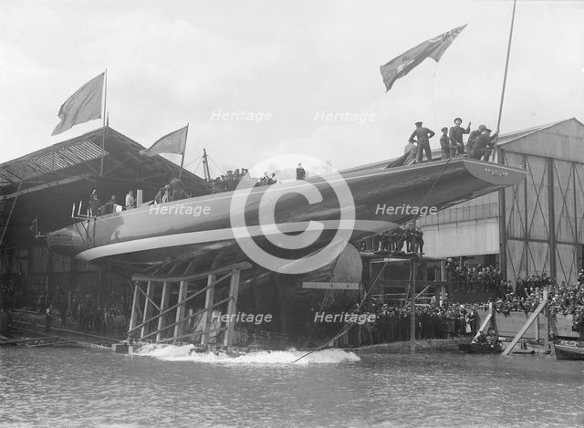 The launch of 'Shamrock IV' at Gosport, May 1914. Creator: Kirk & Sons of Cowes.