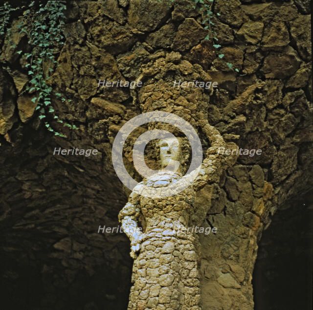 The Laundress', detail of the sculpture in one of the columns of the inside gallery of the Guell …