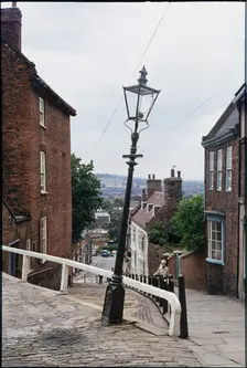 The leaning lamp post at the junction of Steep Hill and Danesgate, Lincoln, Lincolnshire, 1976 Creator: Dorothy Chapman