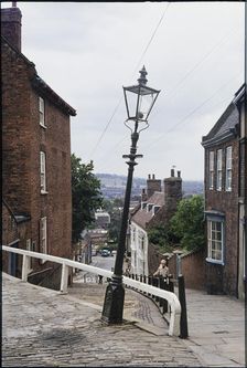 The leaning lamp post at the junction of Steep Hill and Danesgate, Lincoln, Lincolnshire, 1976 Creator: Dorothy Chapman