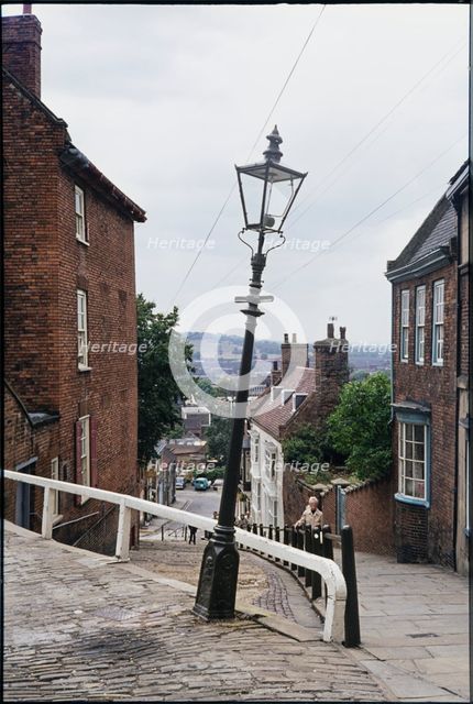 The leaning lamp post at the junction of Steep Hill and Danesgate, Lincoln, Lincolnshire, 1976 Creator: Dorothy Chapman.