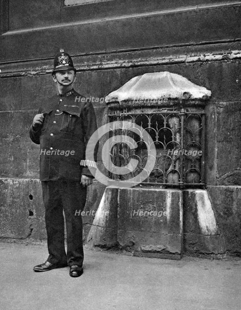 The London Stone in the wall of St Swithin's, Cannon Street, London, 1926-1927. Artist: McLeish