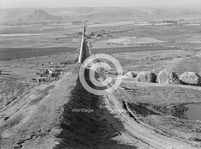 The longest siphon in the world crosses the Malheur Valley, Malheur County, Oregon, 1939. Creator: Dorothea Lange.