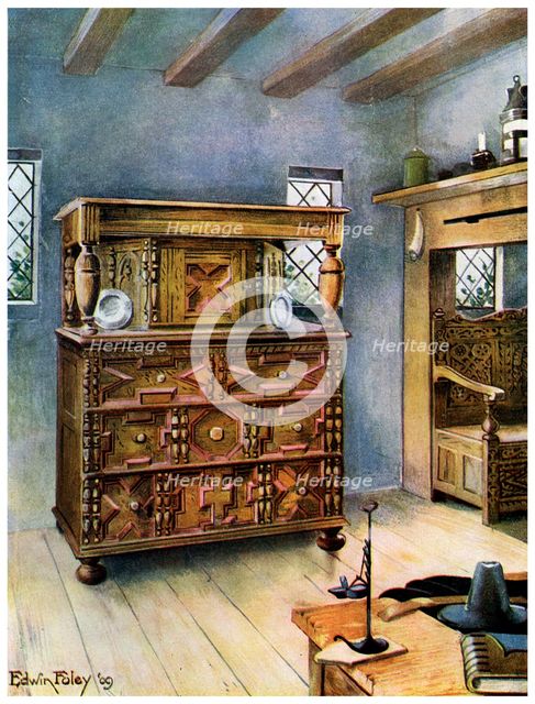 The Putnam Cupboard of English oak and cedar, and carved settle of American oak, 1910.Artist: Edwin Foley