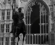 The Palace of Westminster and the Statue of Richard the Lionheart, Damaged by German Bombing, 1941. Creator: British Pathe Ltd