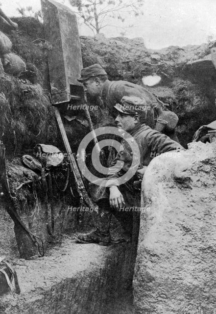 The periscope in use in a French trench, First World War, 1914-1918, (c1920). Artist: Sphere