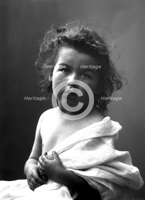The photographer's little girl posing in his studio, Landskrona, Sweden, 1910. Creator: Unknown.