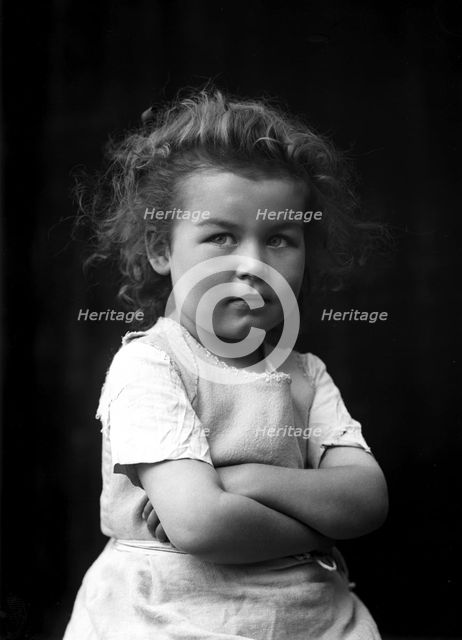 The photographer's little girl posing in his studio, Landskrona, Sweden, 1910. Creator: Unknown.