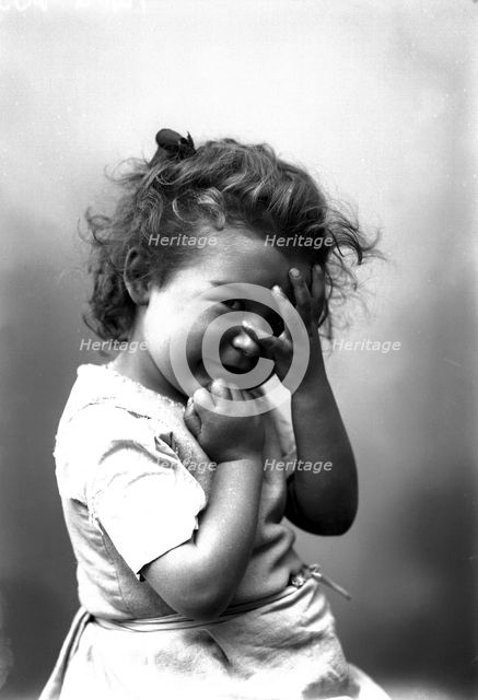 The photographer's little girl posing in his studio, Landskrona, Sweden, 1910. Creator: Unknown.