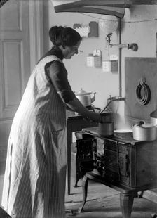 The photographer's wife in the kitchen, Landskrona, Sweden, 1910. Creator: Unknown
