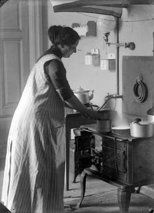 The photographer's wife in the kitchen, Landskrona, Sweden, 1910