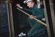 The Pit Deputy prepares for shot firing