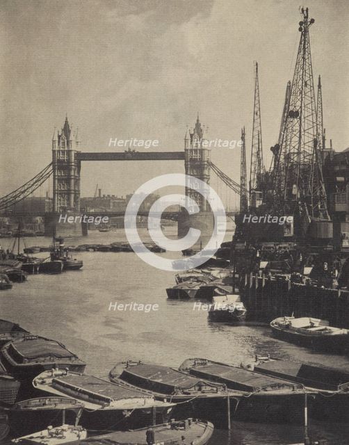 The pool and Tower Bridge. From the album: Photograph album - London, 1920s. Creator: Harry Moult.