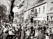 The poor enjoying a one-dish meal to the strains of music, Germany, 1936