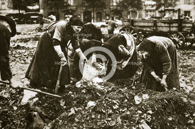 The poor of Berlin rummaging in refuse heaps, Germany, c1914-c1918. Creator: Unknown.