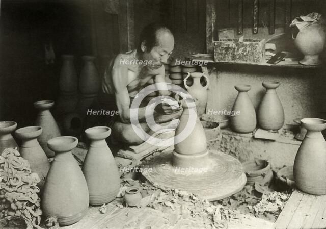 'The Potter at his Wheel', 1910. Creator: Herbert Ponting.