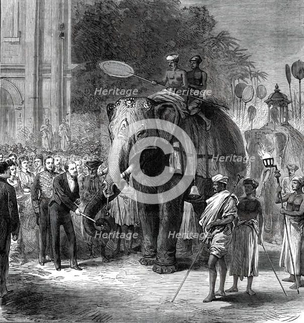 The Prince giving sugar-cane to the elephants at the rehearsal of the Perahara, Kandy..., 1876. Creator: Unknown.