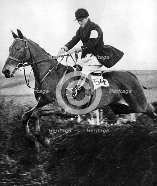 The Prince of Wales taking a fence in the bridge of Guards Challenge Cup race, c1930s. Artist: Unknown