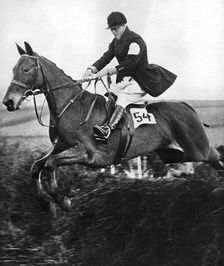 The Prince of Wales taking a fence in the bridge of Guards Challenge Cup race, c1930s
