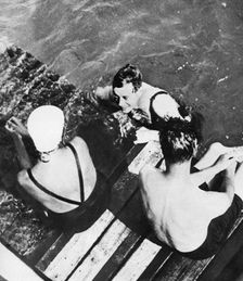 The Prince of Wales with friends on a raft, the Riviera, c1930s