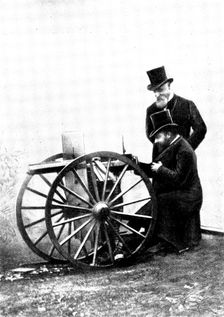 The Prince of Wales firing a Maxim Gun: Mr. Maxim standing by, 1898. Creator: Russell & Sons