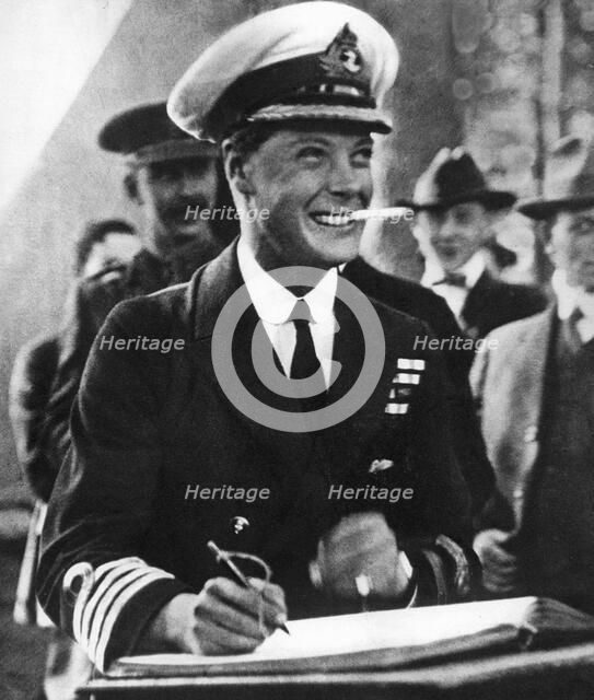 The Prince of Wales signing a visitors' book in Canada, c1920s. Artist: Unknown