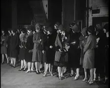 The Producer Julian Wylie Inspecting Young Prospective Female Stage Performers Standing..., 1920s. Creator: British Pathe Ltd