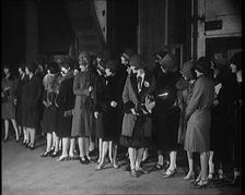 The Producer Julian Wylie Inspecting Young Prospective Female Stage Performers Standing..., 1920s. Creator: British Pathe Ltd