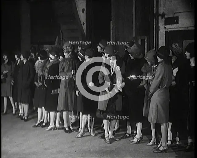 The Producer Julian Wylie Inspecting Young Prospective Female Stage Performers Standing..., 1920s. Creator: British Pathe Ltd.