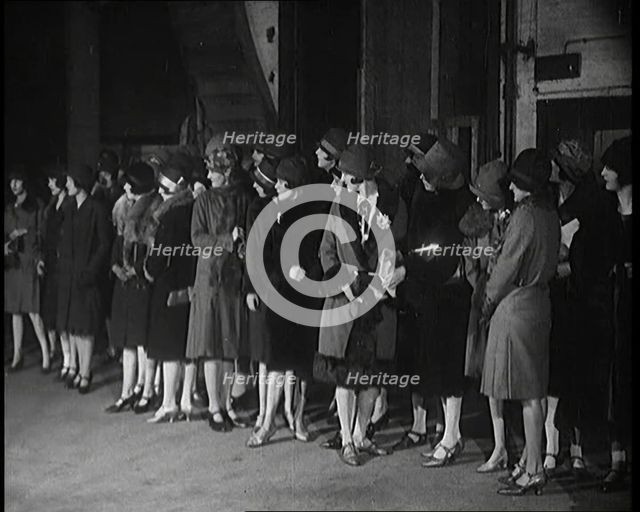 The Producer Julian Wylie Inspecting Young Prospective Female Stage Performers Standing..., 1920s. Creator: British Pathe Ltd.