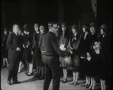 The Producer Julian Wylie Inspecting Young Prospective Female Stage Performers Standing..., 1920s. Creator: British Pathe Ltd