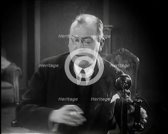 The Producer Julian Wylie Speaking on a Telephone, 1920s. Creator: British Pathe Ltd.