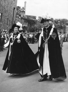 The Queen and Prince Philip walking in procession to the Queen's Free Chapel of St George, 1970. Creator: Unknown