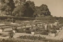 The Quiet of the Dutch Garden at Kensington Palace Guarded By Locked Gates c1935. Creator: Unknown