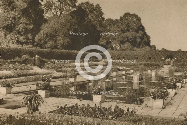 'The Quiet of the Dutch Garden at Kensington Palace Guarded By Locked Gates', c1935. Creator: Unknown.