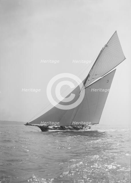 The racing cutter 'Creole' under sail, 1911. Creator: Kirk & Sons of Cowes.