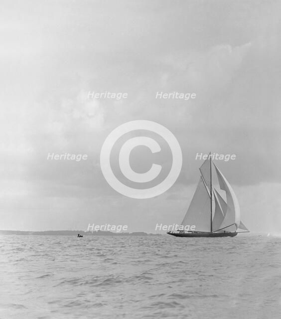 The racing cutter 'Terpisichore' running downwind, 1922. Creator: Kirk & Sons of Cowes.