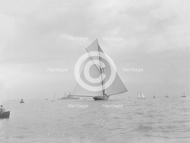 The racing cutter 'Terpisichore' running downwind, 1922. Creator: Kirk & Sons of Cowes.