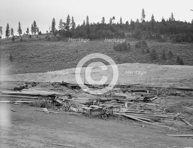 The remains of the sawmill in a deserted mill town, Tamarack, Adams County, Idaho, 1939. Creator: Dorothea Lange.