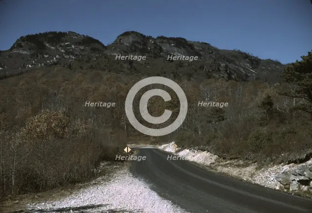 The road along the Skyline Drive, with a light snowfall in the rocks beside, Virginia, ca. 1940. Creator: Jack Delano.