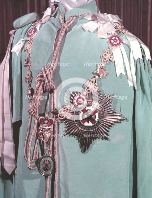 The robes, regimental badge and insignia of the Irish Guards, 1953.  Creator: Arthur Charles Kirby Ware.
