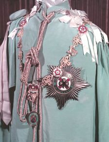The robes, regimental badge and insignia of the Irish Guards, 1953. Creator: Arthur Charles Kirby Ware