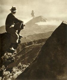 The Rotorua district in the North Island of New Zealand - The climber is resting on a rocky promine Creator: Unknown