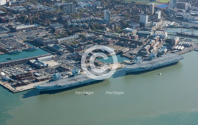 The Royal Navy's two largest aircraft carriers in dock, Portsmouth, Hampshire, 2020. Creator: Damian Grady.