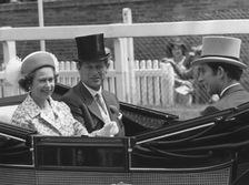 The Royal party driving down the course on the first day of Royal Ascot, 17th June 1975. Creator: Unknown
