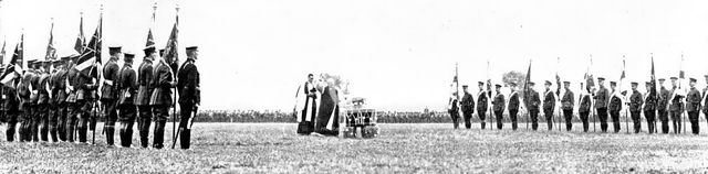 The Royal Review...in Worsley Park:...the Bishop of Manchester blessing the Colours..., 1909. Creator: Topical Press Agency.