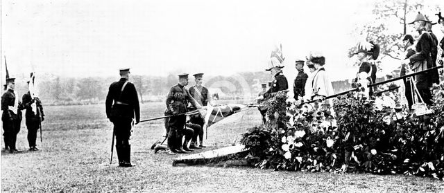 The Royal Review...in Worsley Park:...the King touching the staffs..., 1909. Creator: Topical Press Agency.